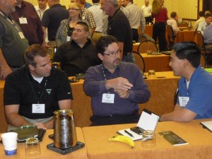 Attendees emphasizing different perspectives. Pictured are, left to right, Jon Heinen, Vermeer; Grady Bell, Laney Directional Drilling; and Adam Hamman, H&H Enterprises.