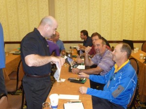 Facilitator Wally Adamchik makes a point to Kevin Miller and Scott Miller of Miller Pipelines.