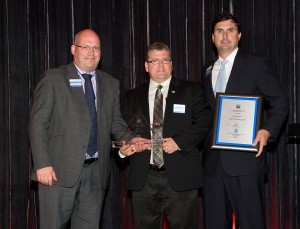 Adam Wynne Hughes (left), IPLOCA Health and Safety committee chair, presents an award to Willbros in recognition of their “Investing in Safety” program using safety talismans to increase worker awareness. Representing  the Willbros Group are Brad MacLean (center) and Jerrit Coward.